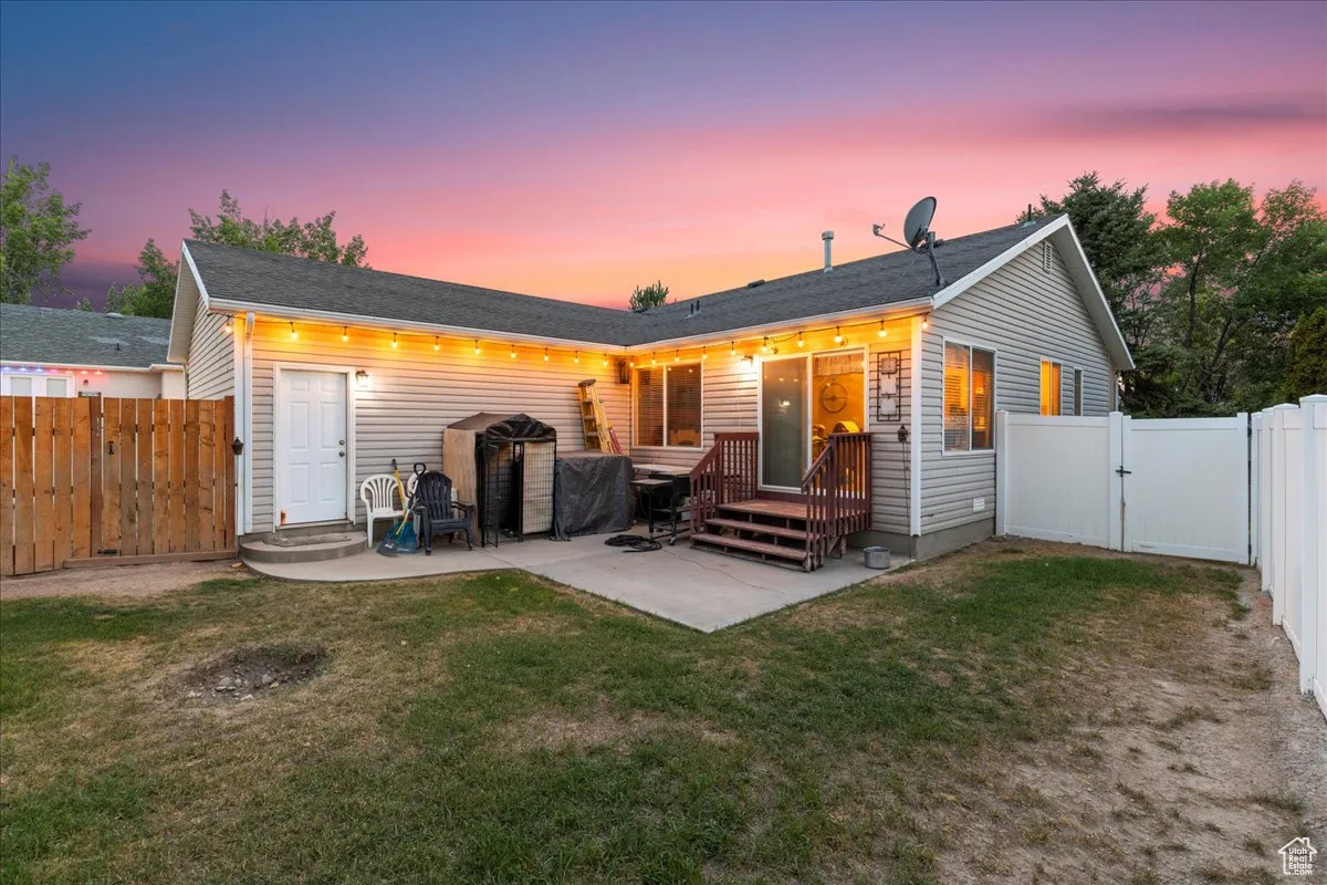 Back of house with a patio, a gate, and a fenced backyard