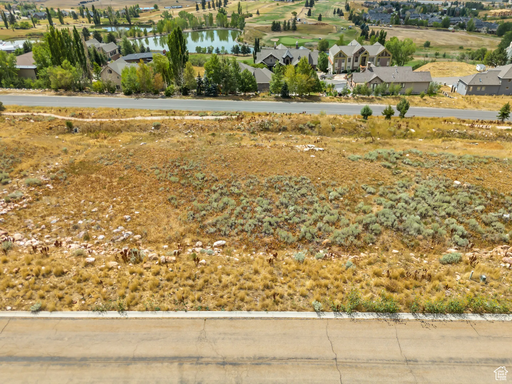 Aerial perspective of suburban area with a large body of water