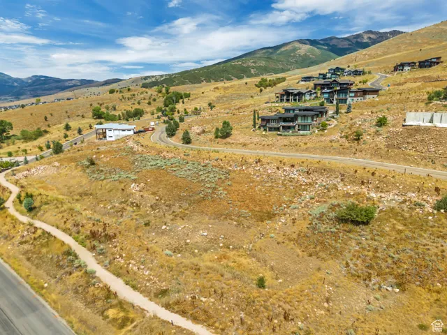 Overview of rural landscape featuring a mountain backdrop