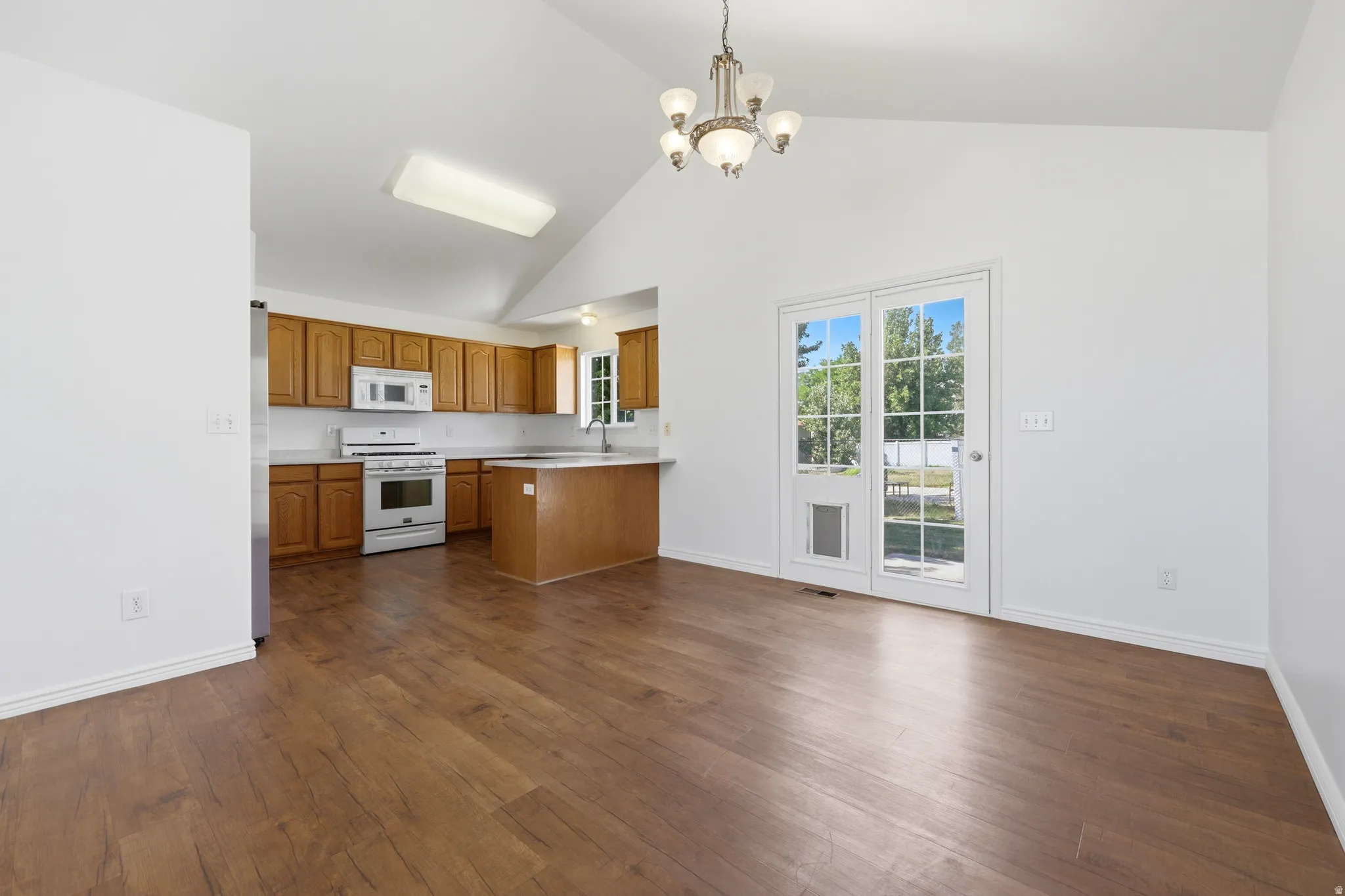 Vaulted ceilings above wood-finish flooring