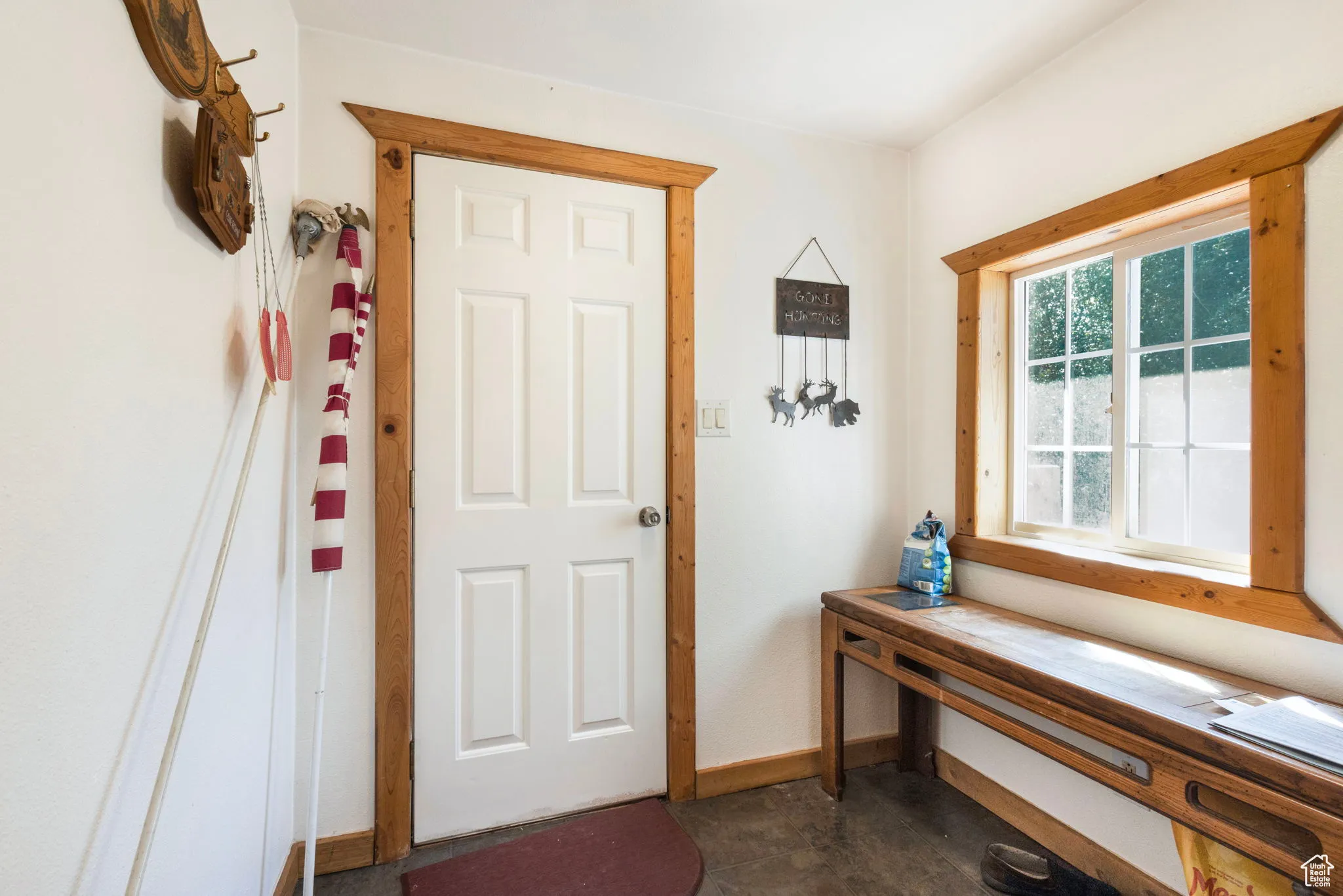 Entryway featuring baseboards and tile patterned floors