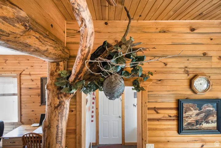 Detailed view of wood walls, wooden ceiling, and an office area