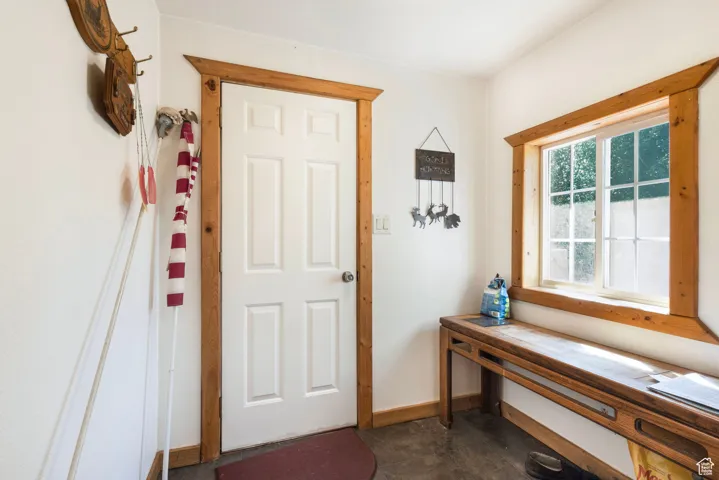 Entryway featuring baseboards and tile patterned floors