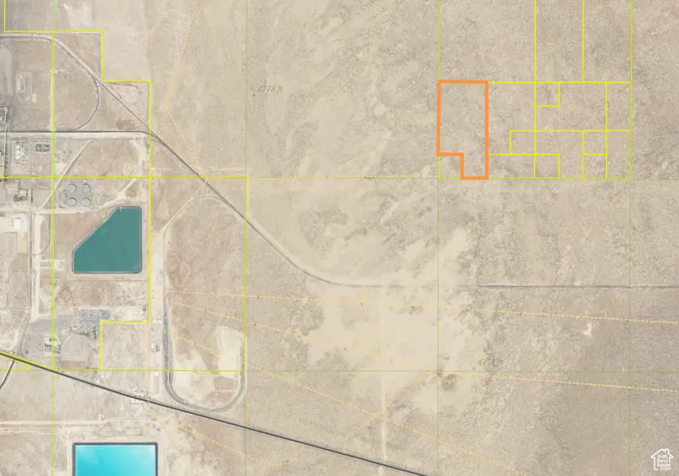 Aerial map of property and surrounding area featuring property parcel outlined