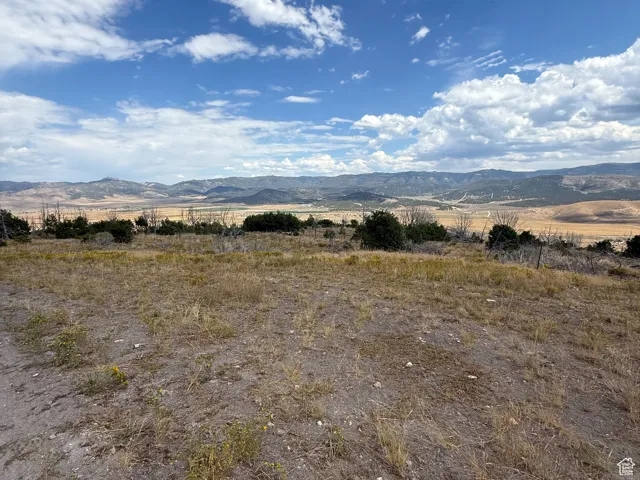 View of yard with a view of countryside and a mountain view