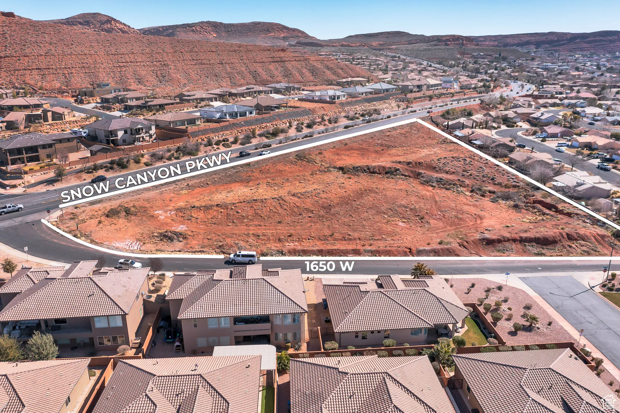Aerial view of residential area with a mountain backdrop