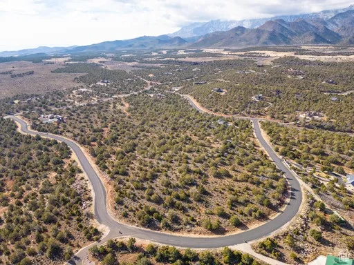 Overview of rural landscape with a mountain backdrop and a desert landscape