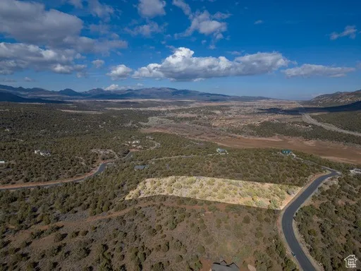 Overview of rural landscape with a mountain backdrop and a desert landscape