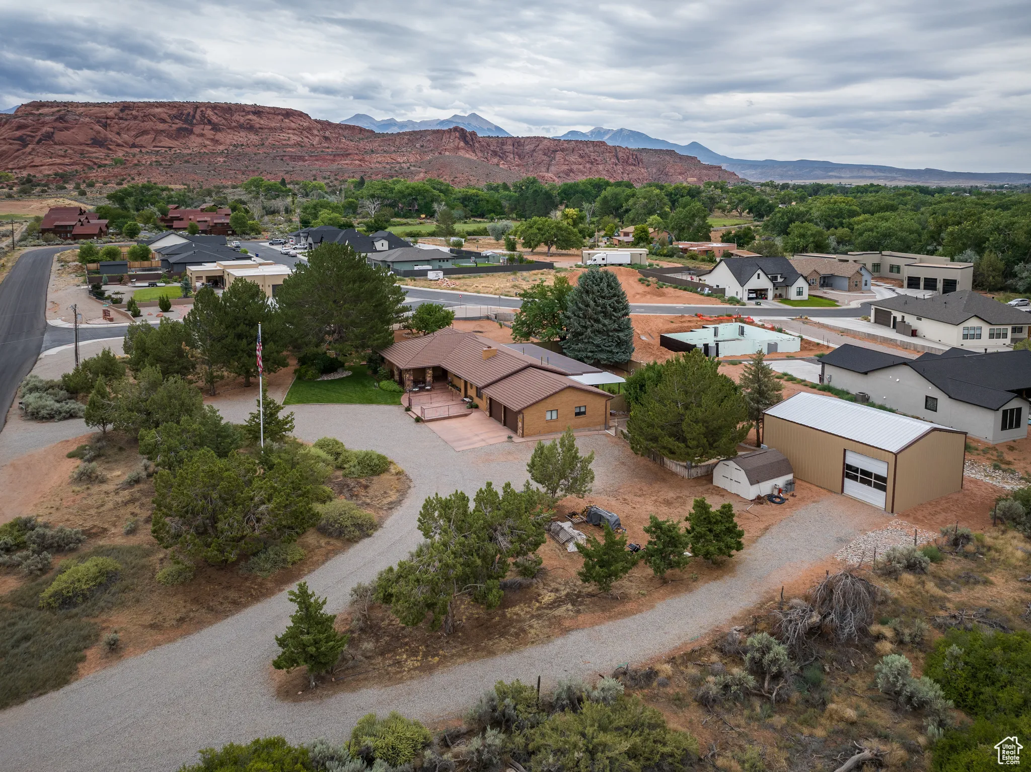 Aerial perspective of suburban area with a mountainous background
