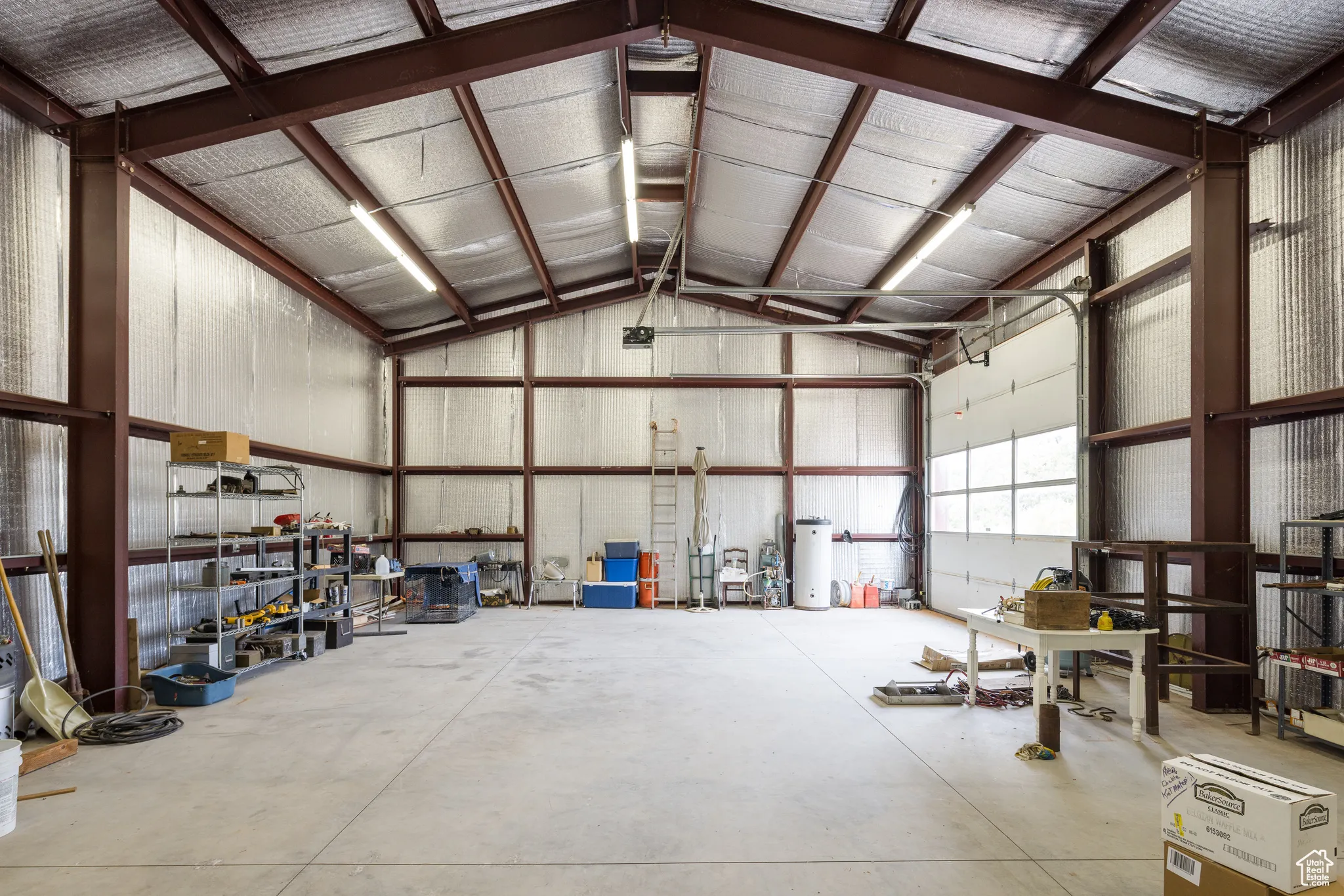 Garage featuring metal wall
