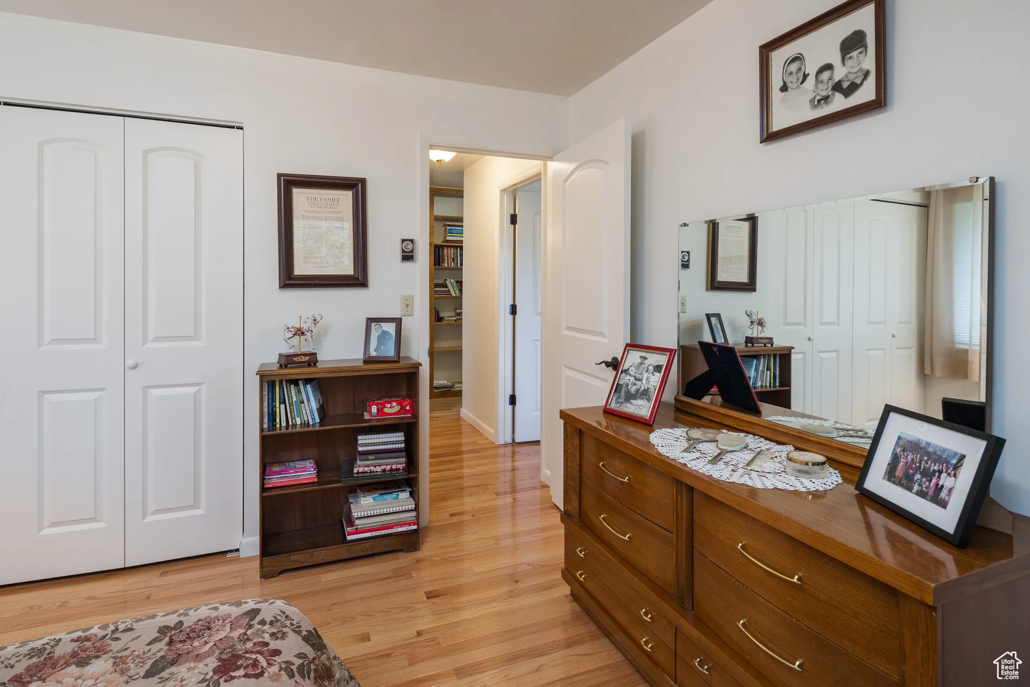 Bedroom with a closet and light wood-style floors