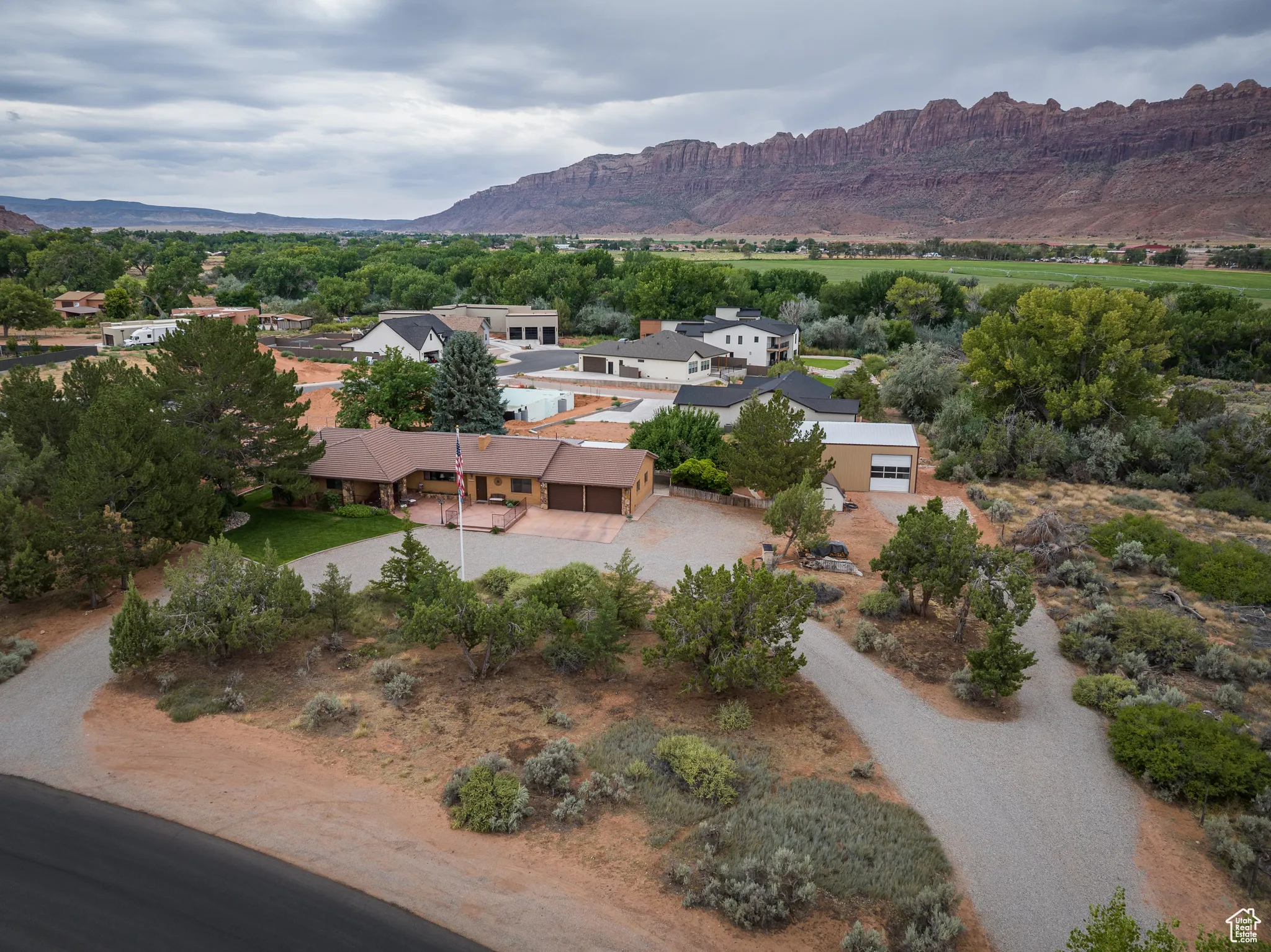 View from above of property with a mountain backdrop