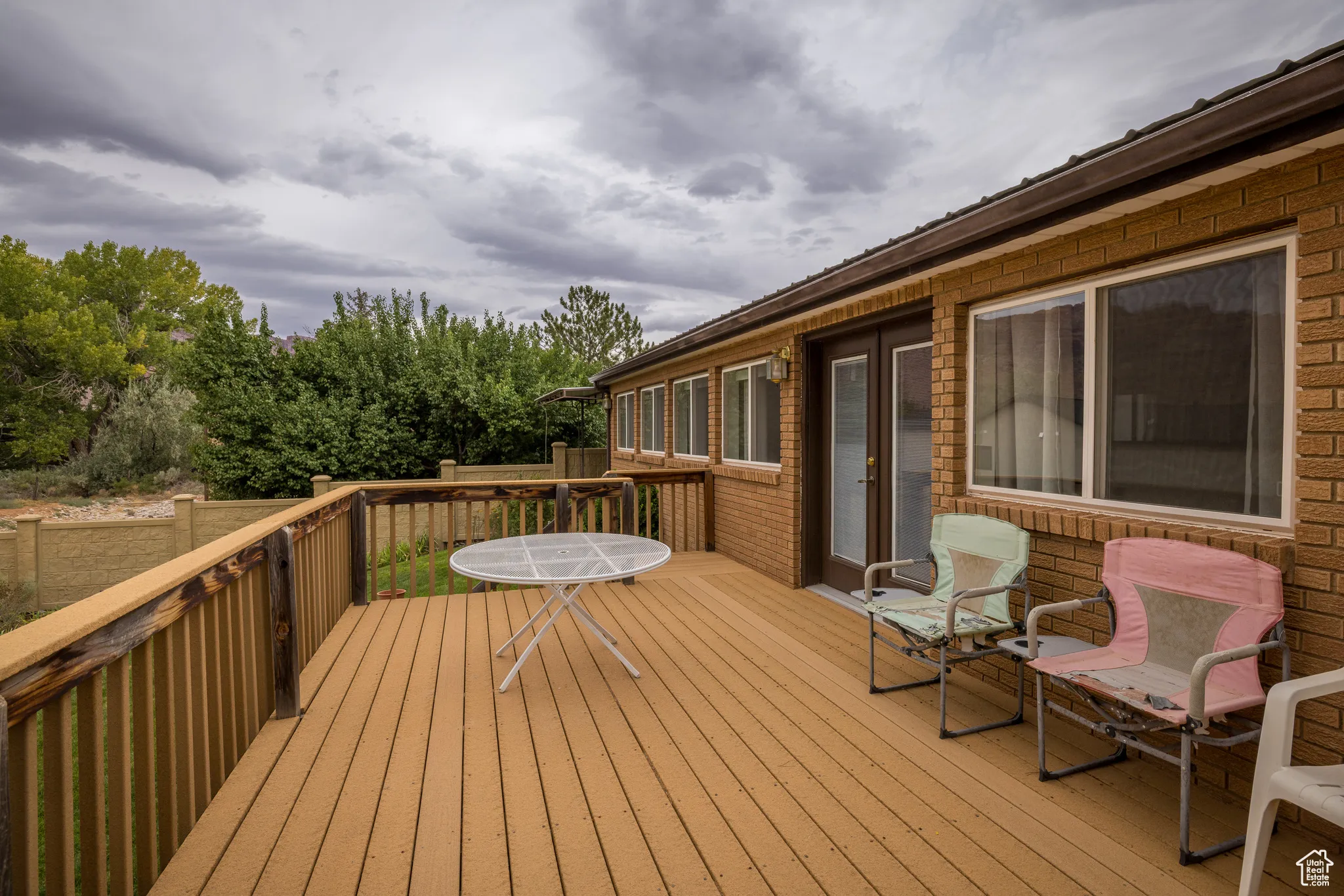 Deck with view of wooded area