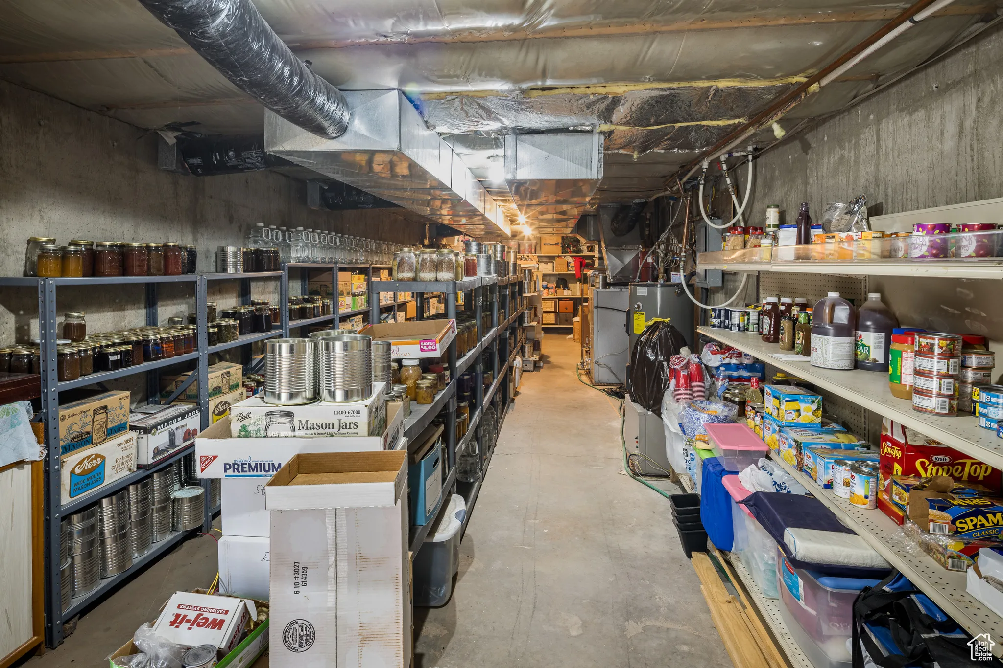 Storage area featuring water heater