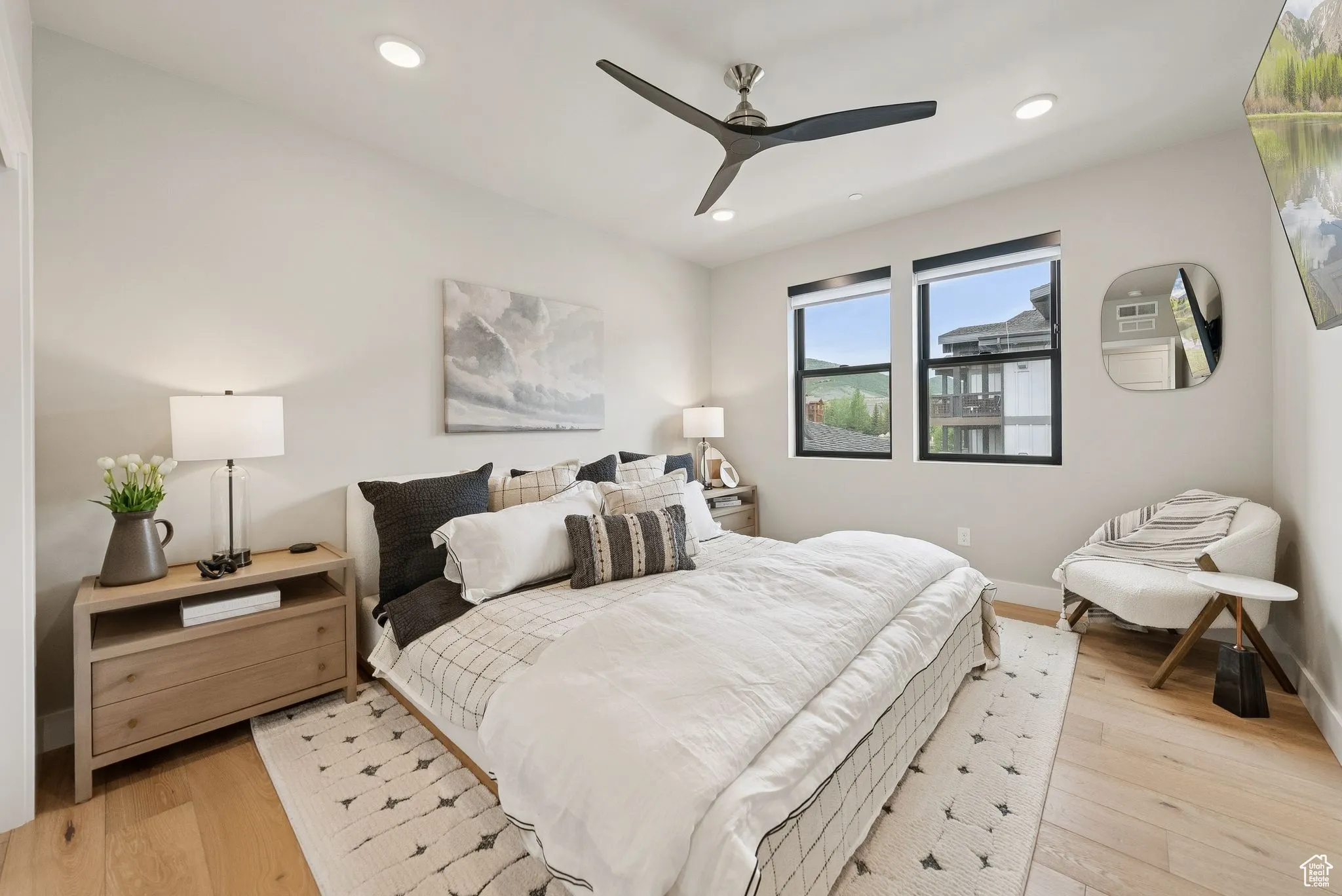 Bedroom with light wood-type flooring, recessed lighting, and a ceiling fan