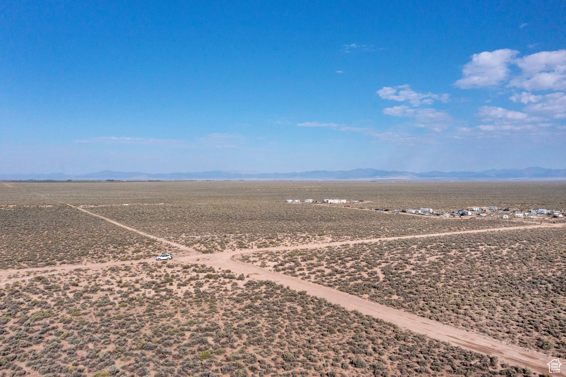 View of rural area featuring a mountainous background and a desert landscape