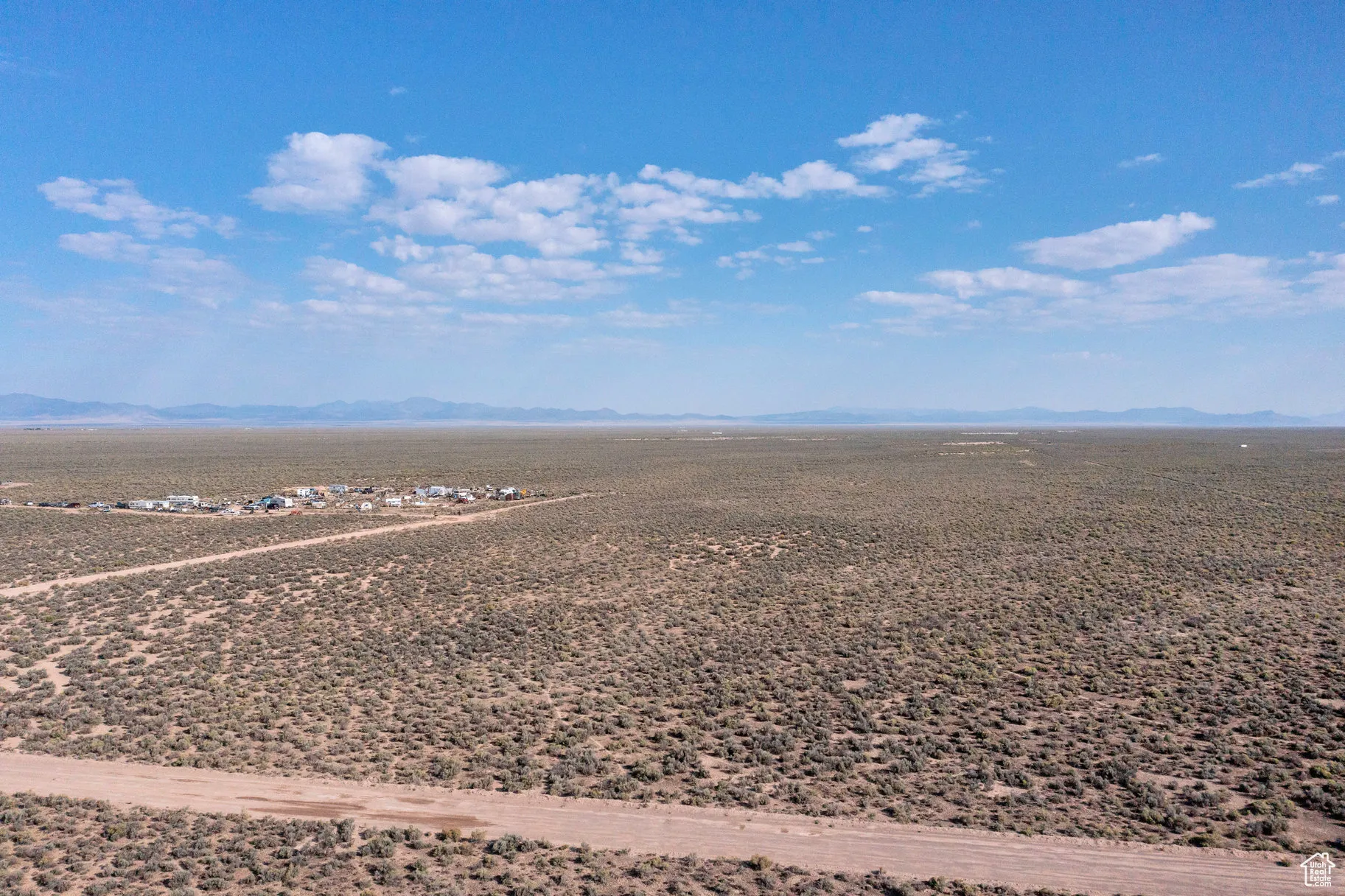 View of rural area featuring a mountainous background and a desert landscape