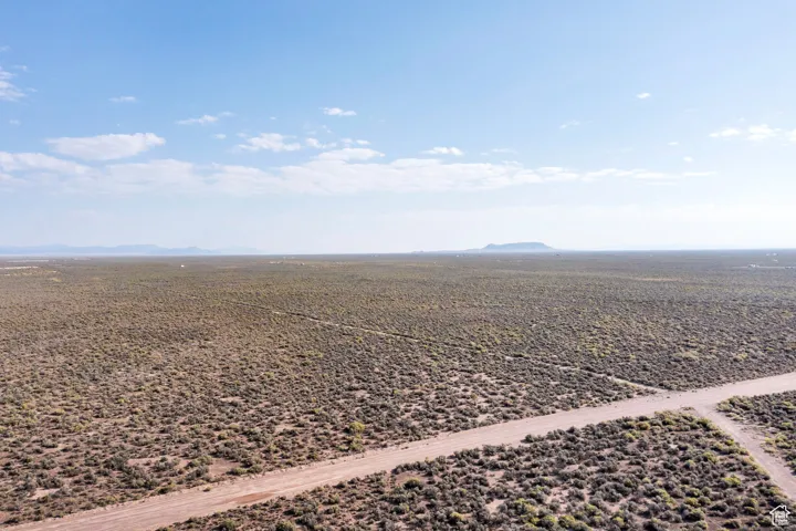 Overview of rural landscape with a mountain backdrop and a desert landscape