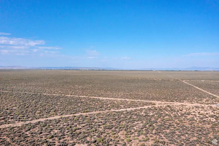 Overview of rural landscape with a mountain backdrop