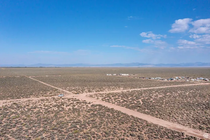 View of rural area featuring a mountainous background and a desert landscape