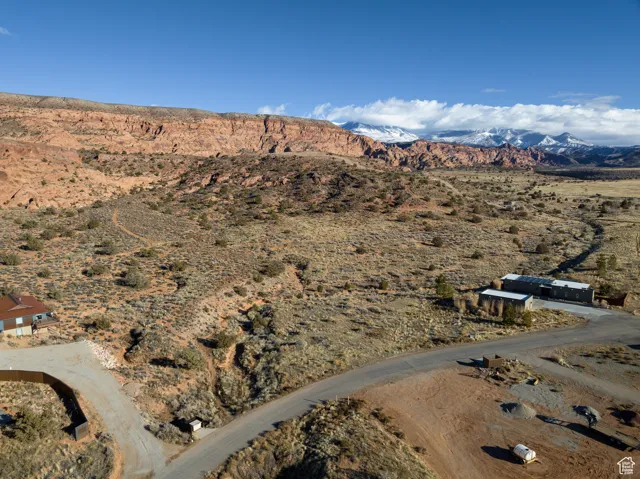 Aerial view of sparsely populated area with a mountainous background