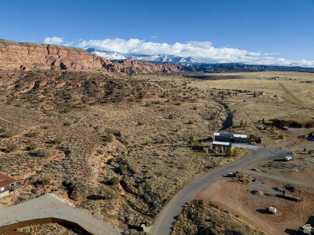 Aerial view of property's location featuring mountains and rural landscape