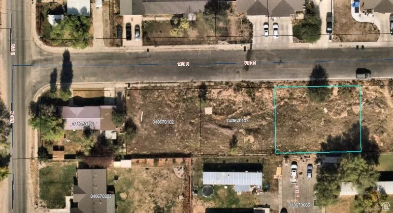 Aerial map of property and surrounding area featuring property boundaries highlighted