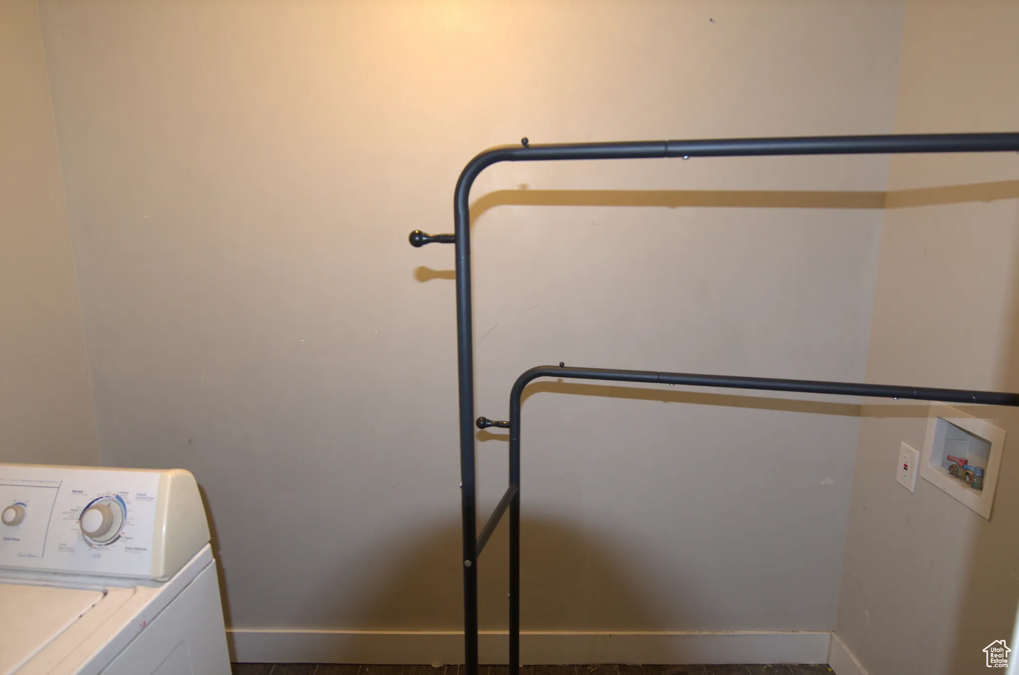 Laundry room featuring washer / dryer and baseboards