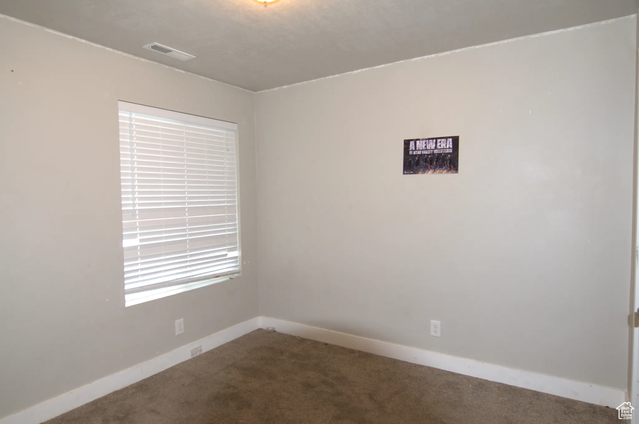 Unfurnished room featuring carpet flooring and baseboards