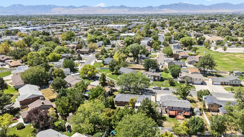 Aerial perspective of suburban area with a mountain backdrop