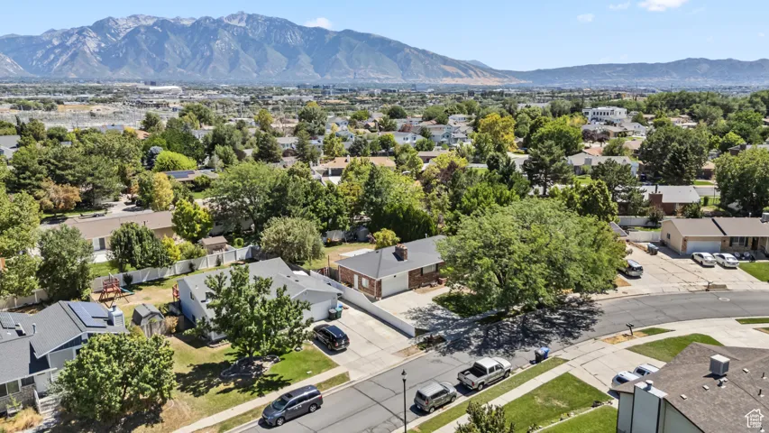 Aerial perspective of suburban area featuring a mountainous background