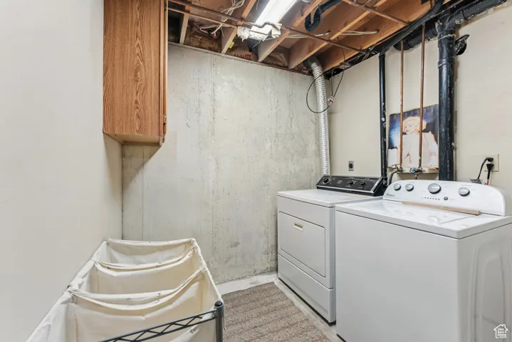 Laundry room with washer and dryer and cabinet space