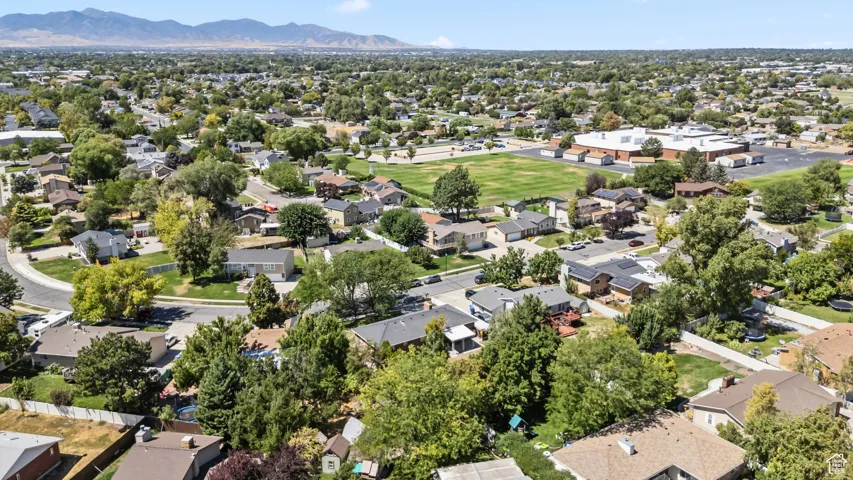 Aerial perspective of suburban area featuring a mountain backdrop
