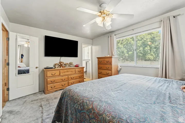 Bedroom with carpet floors and ceiling fan