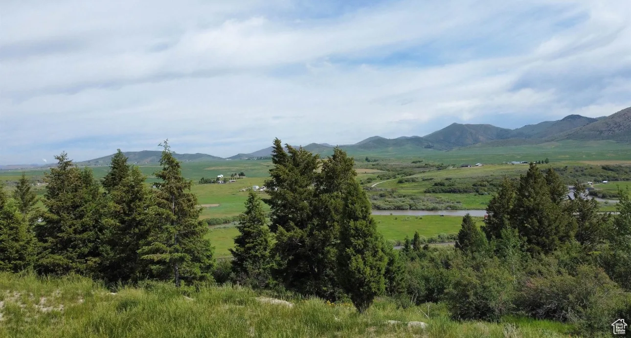 Mountain view with rural landscape and a large body of water