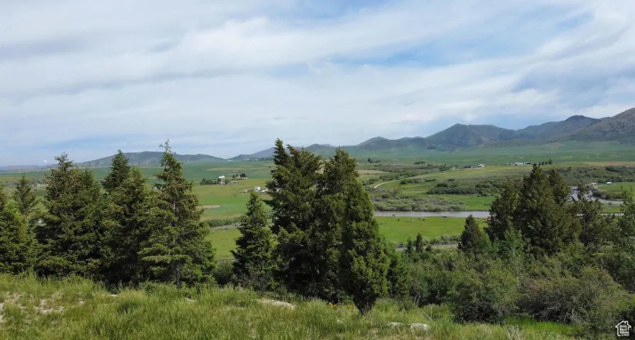 Mountain view with rural landscape and a large body of water