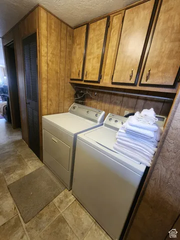 Laundry area with cabinet space.