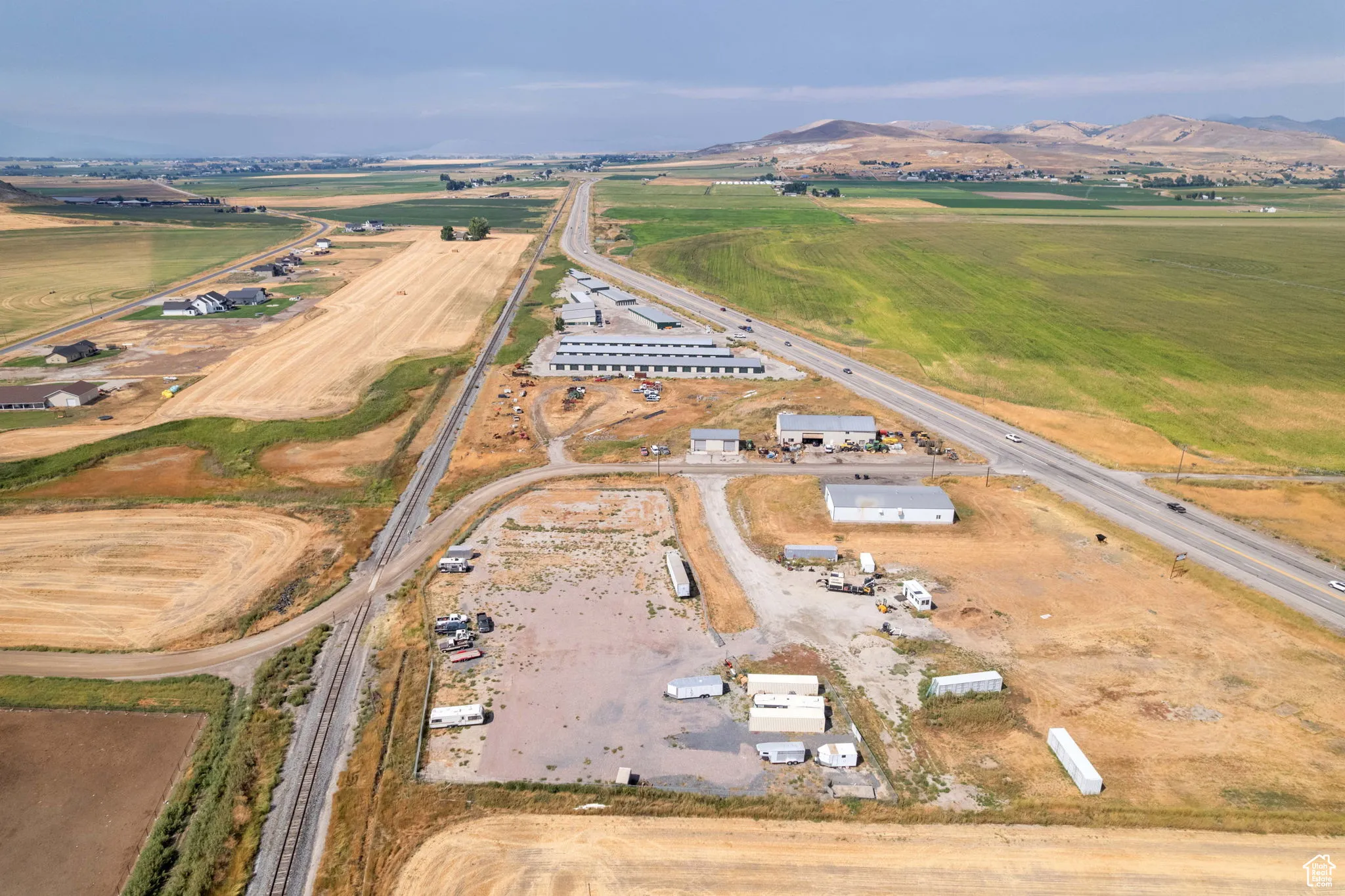 Aerial overview of property's location featuring a mountainous background