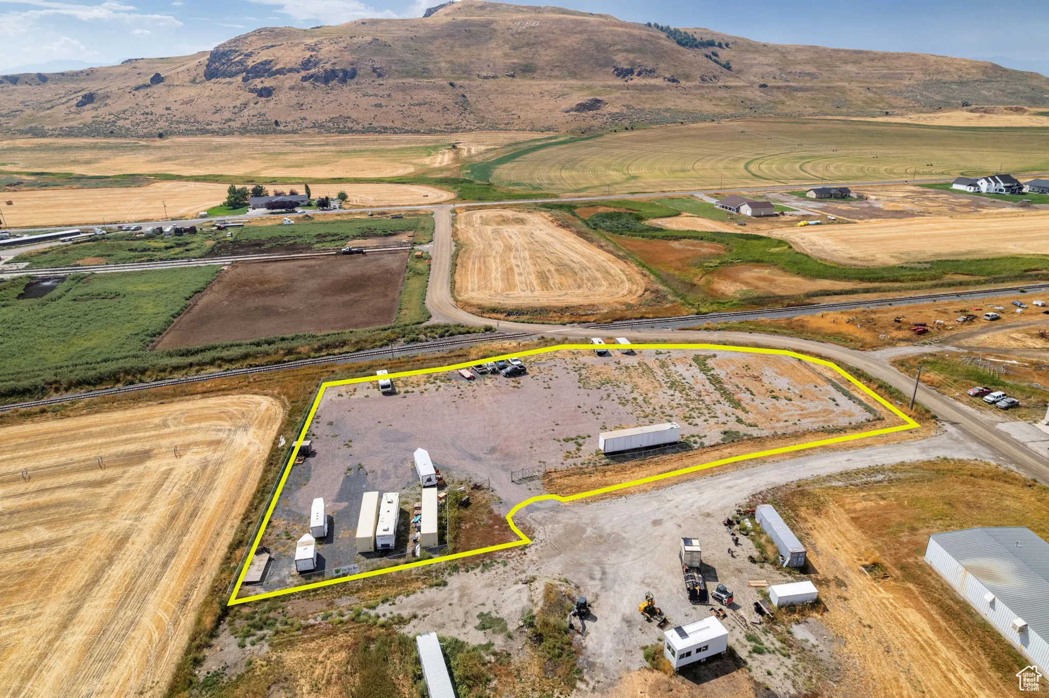 Overview of rural landscape featuring mountains and property parcel outlined