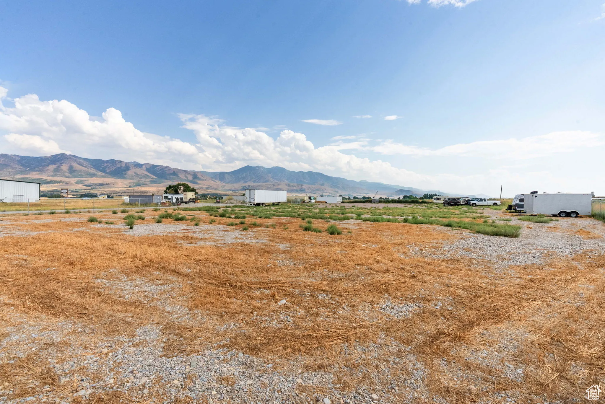 View of mountain backdrop featuring rural landscape