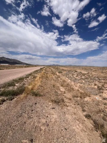View of asphalt road featuring a view of countryside