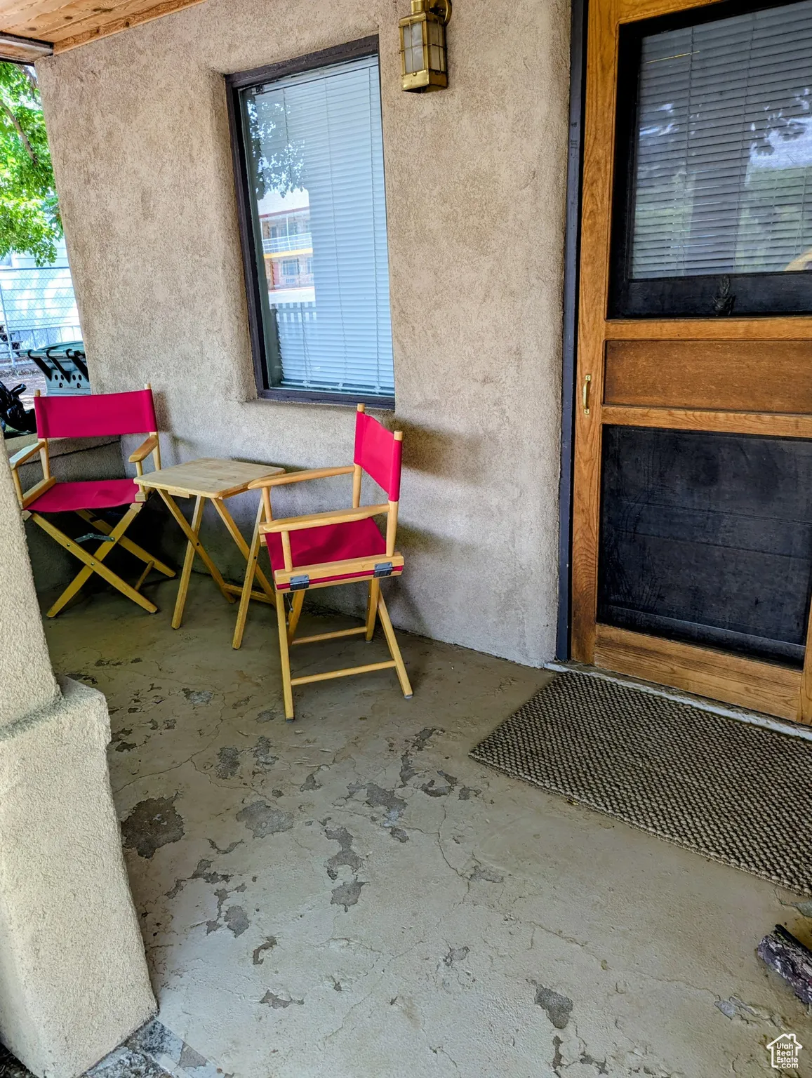 View of exterior entry with stucco siding