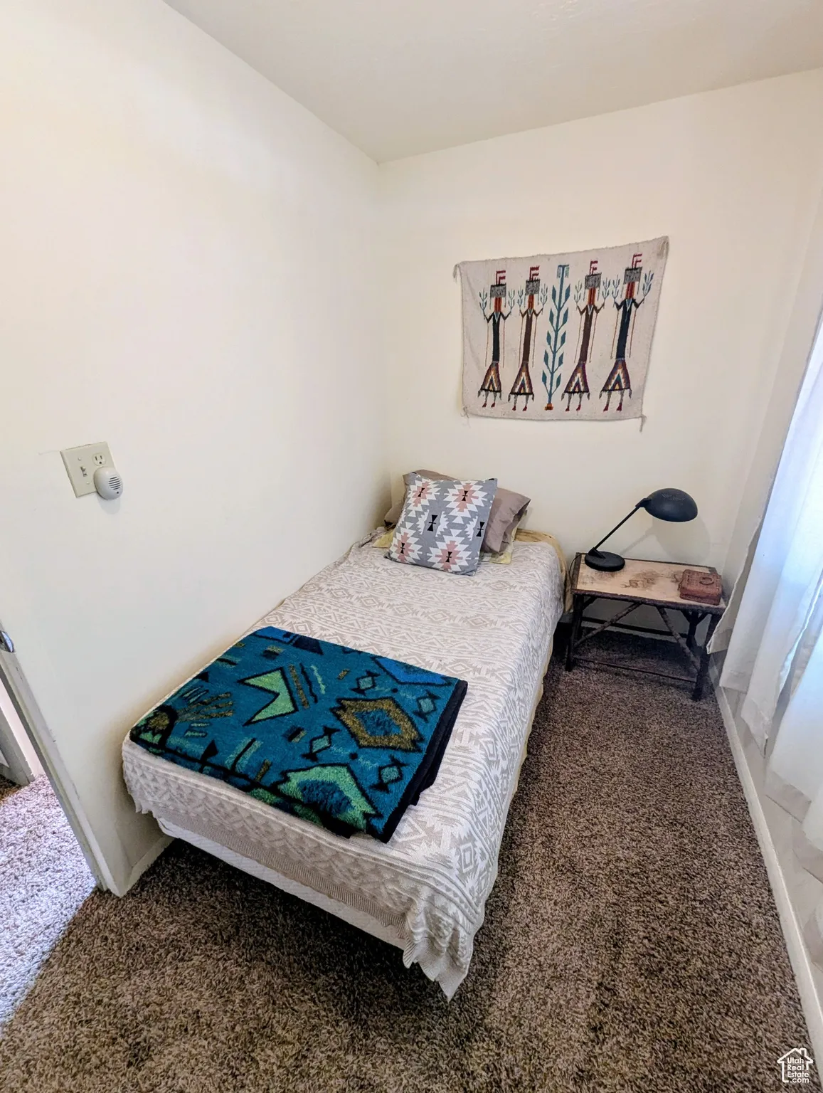 Bedroom with dark carpet