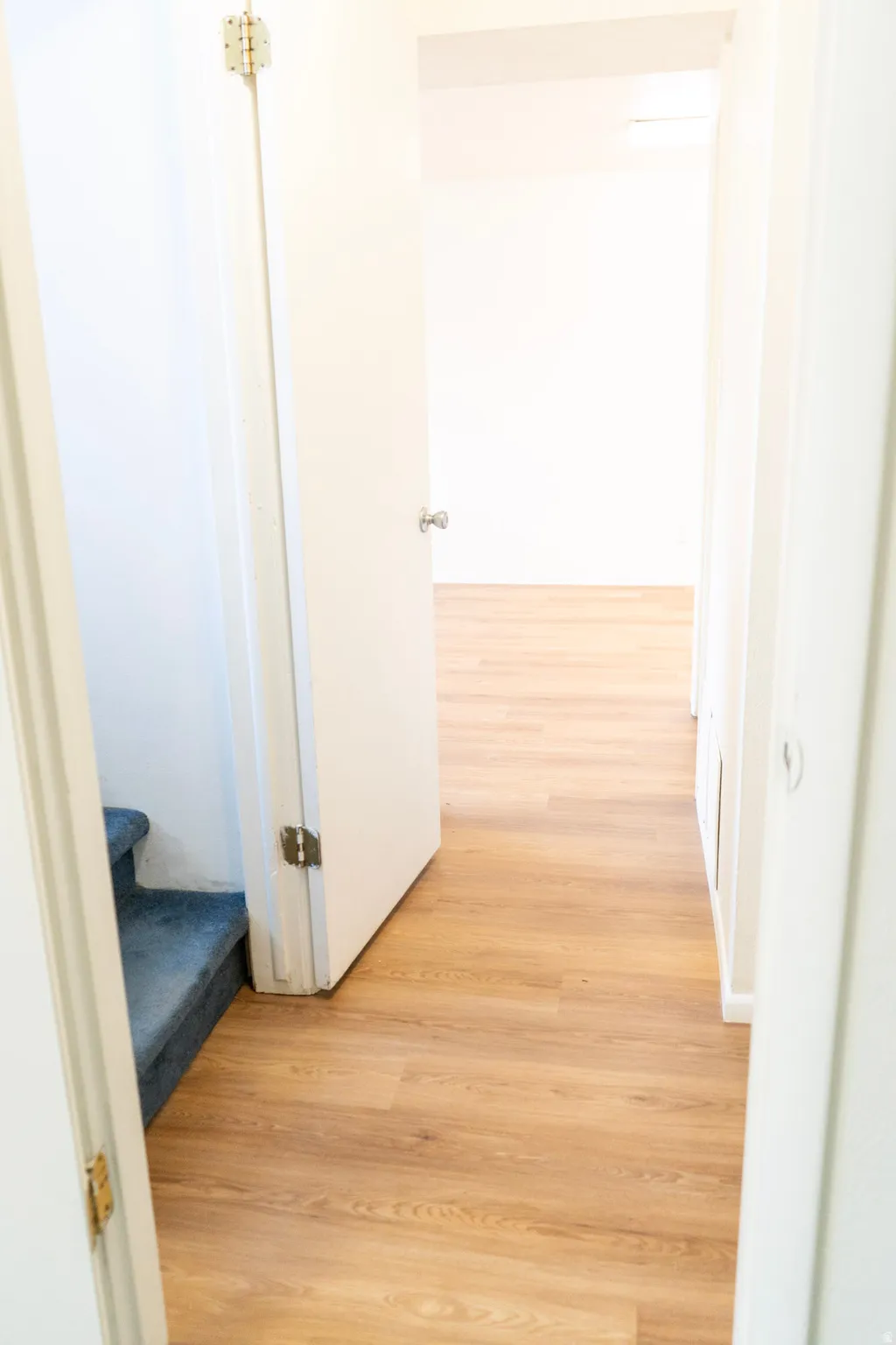 Hall with light wood-style floors