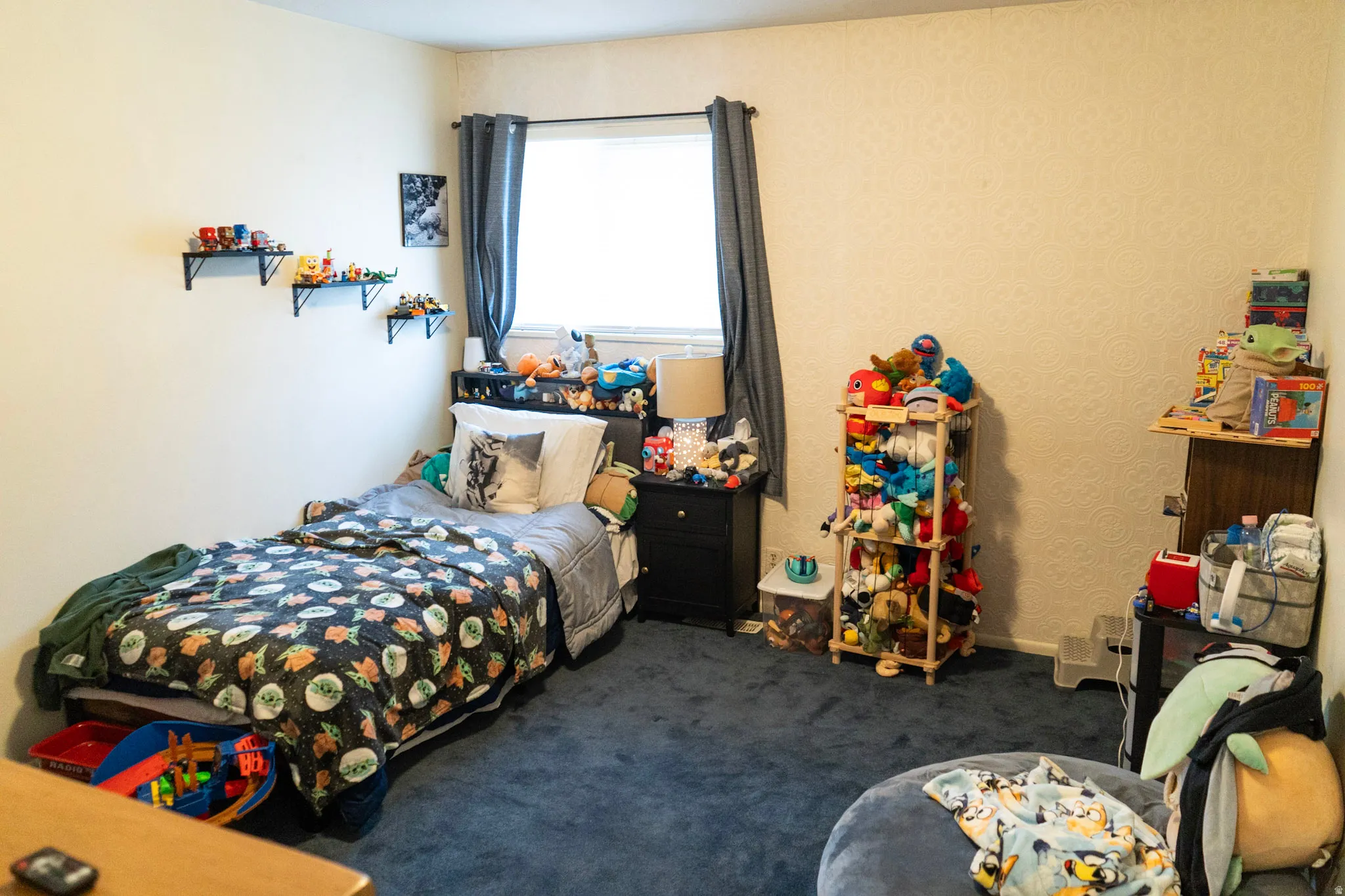 Bedroom featuring dark carpet