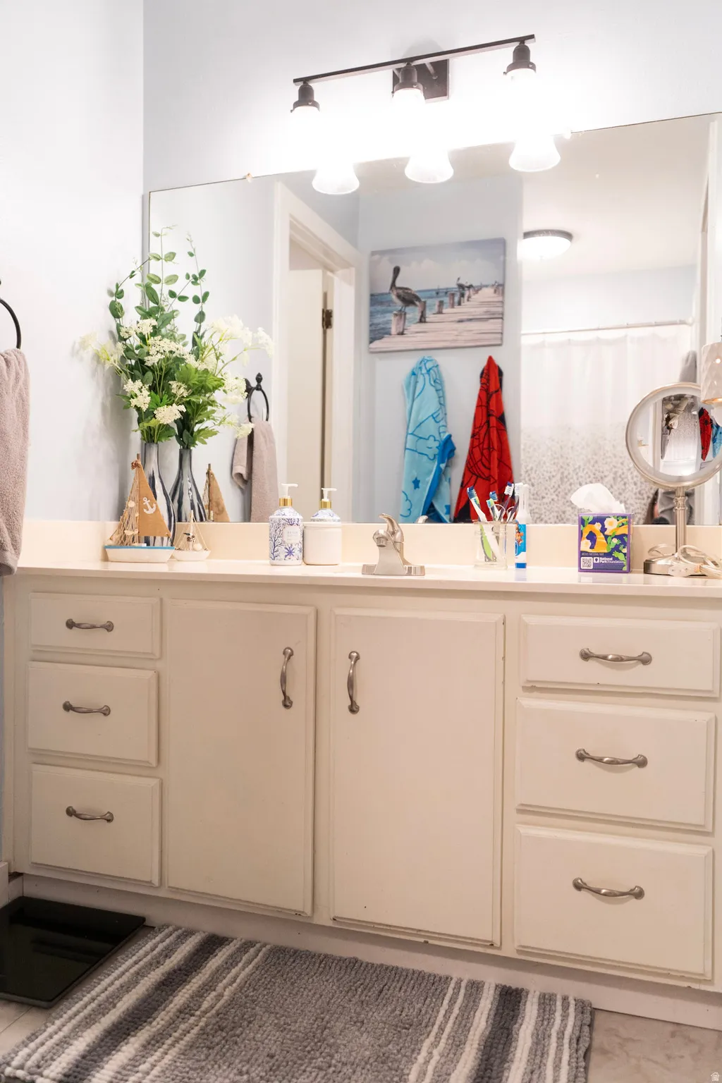 Bathroom with vanity and a shower with shower curtain