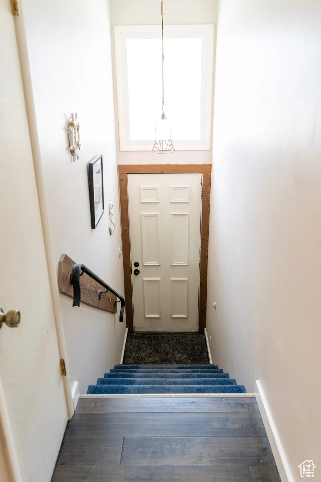 Stairway with wood finished floors