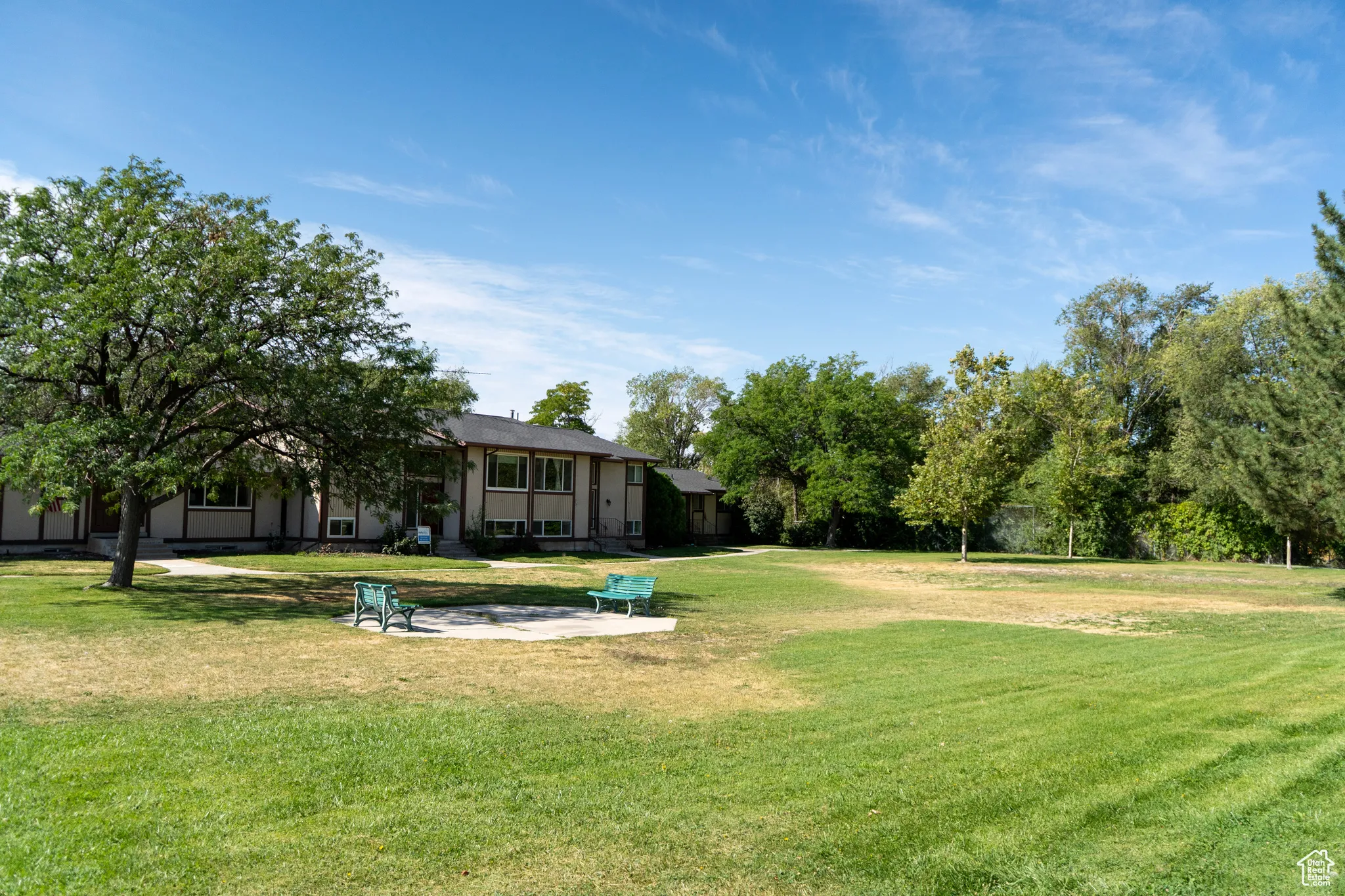 View of green lawn featuring a patio area