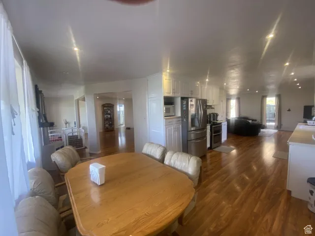 Dining room with dark wood-style floors