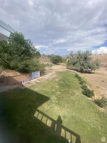 View of green lawn with a view of rural / pastoral area